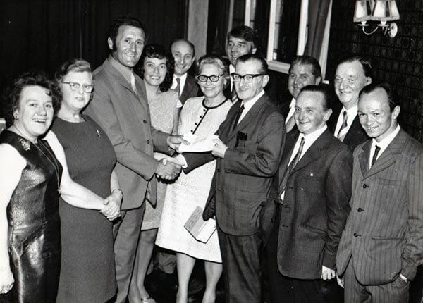 Roy Sproson is presented with an award