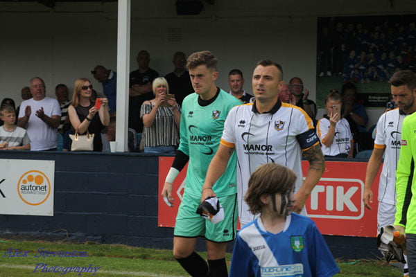 Captain Antony Kay walks out