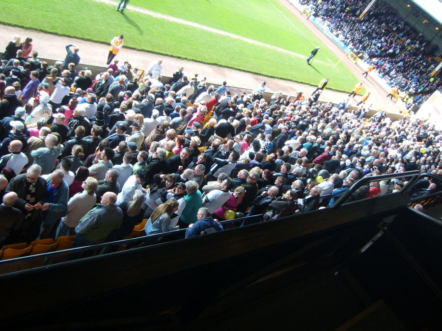 A packed Lorne St stand Tom Pope is carried aloft by the crowd - Port Vale v Northampton Town 2013
