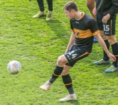 Adam Crookes warms up