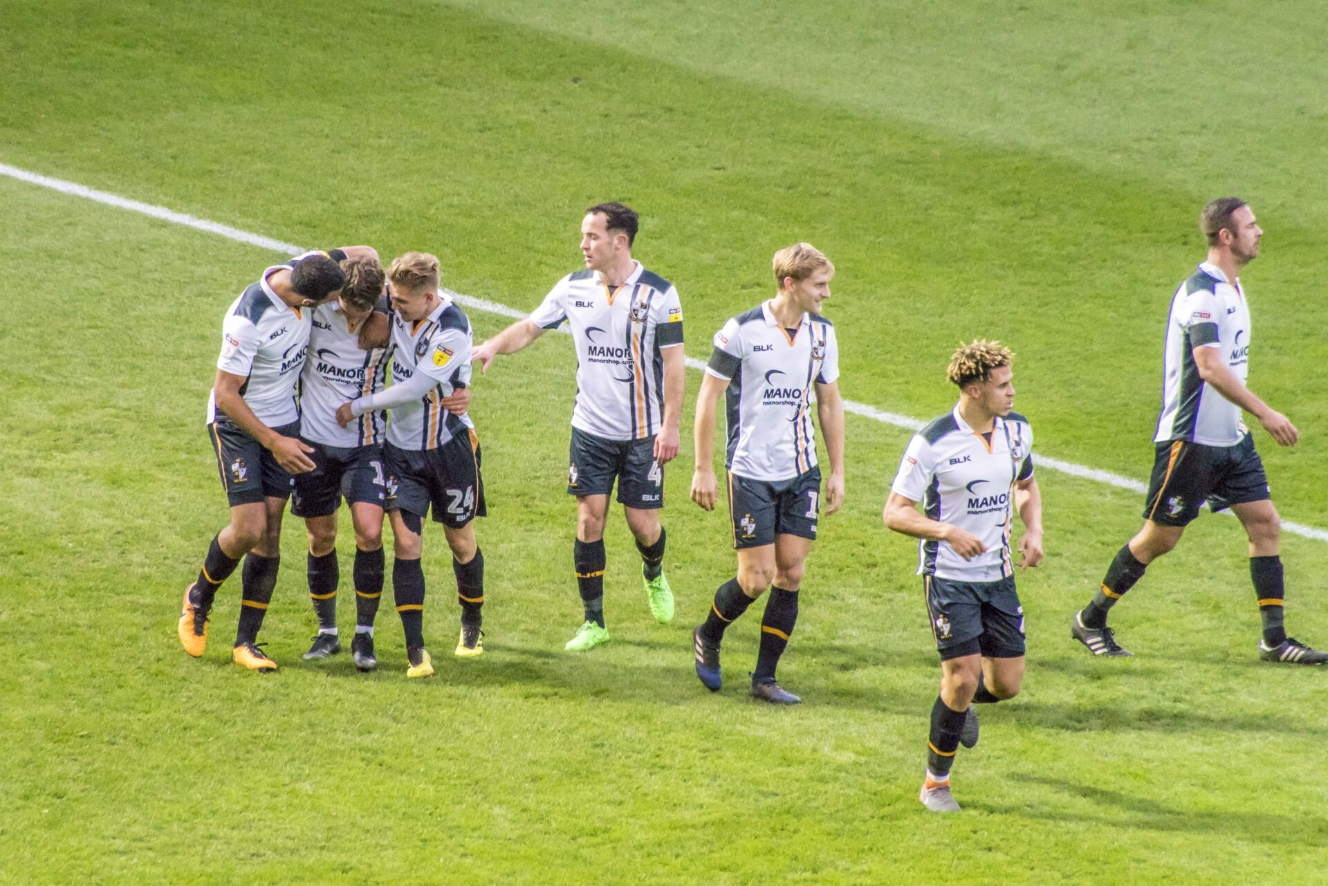 Luke Hannant is congratulated by team mates after his goal against Notts County