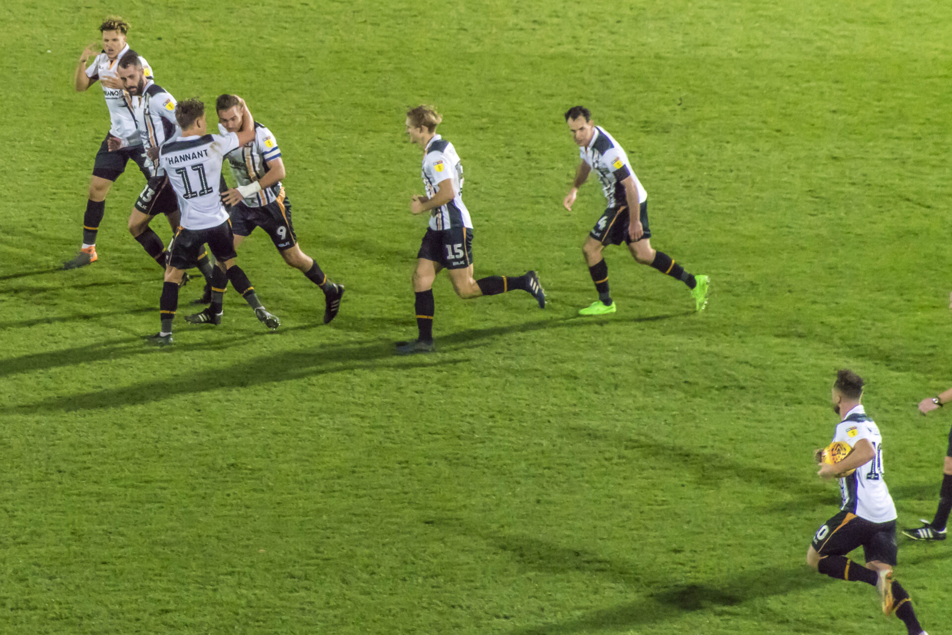 Tom Pope is congratulated after his equaliser against Notts County