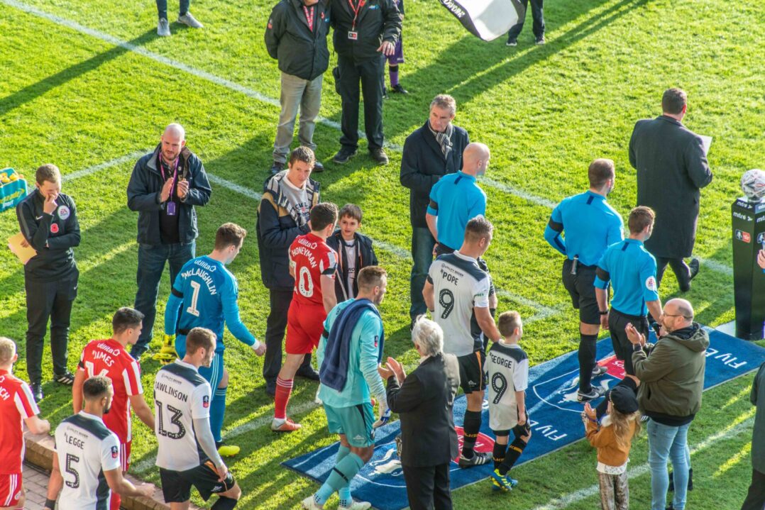 The two teams come out