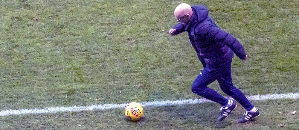 Neil Aspin gives a blast from the past during the game against Notts County.