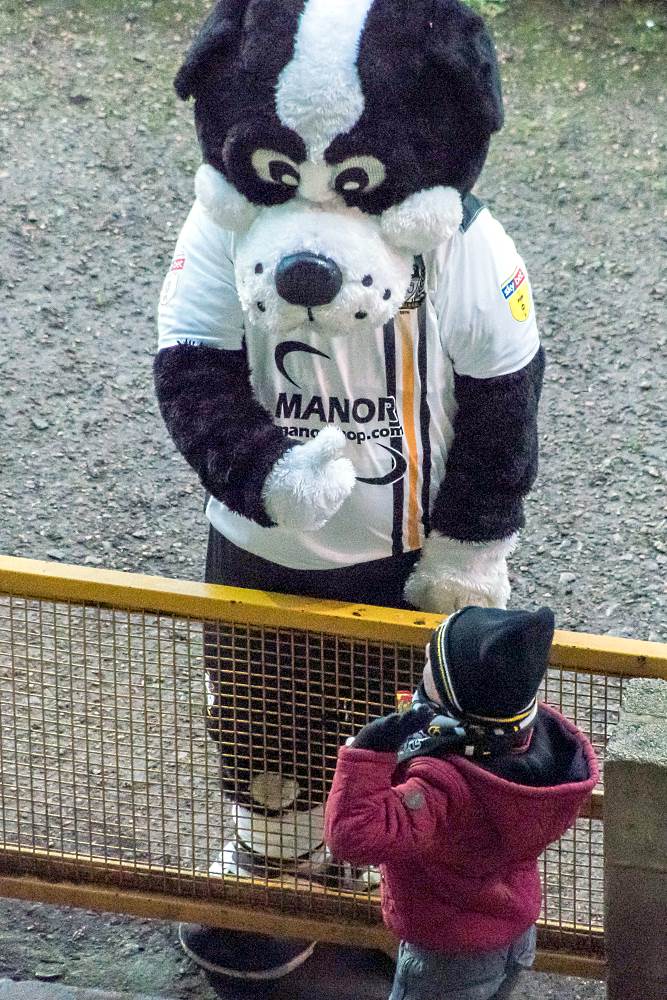 Boomer and young fan during the game against Colchester United.