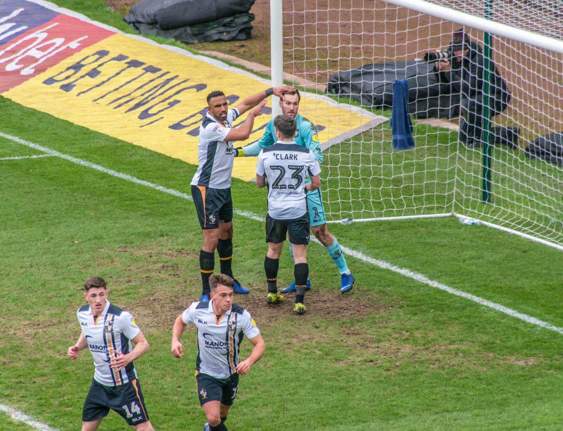 Port Vale 2-1 Mansfield Town - keeper Scott Brown is congratulated after his penalty save