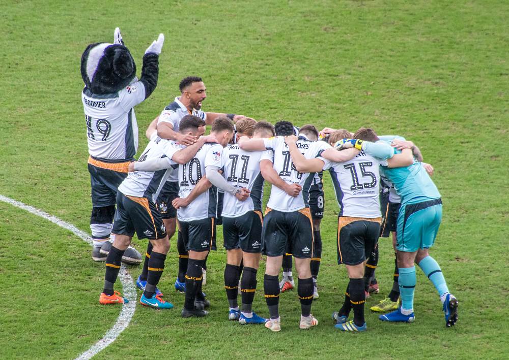 Boomer and Leon Legge rally the players ahead of the win over Mansfield Town.