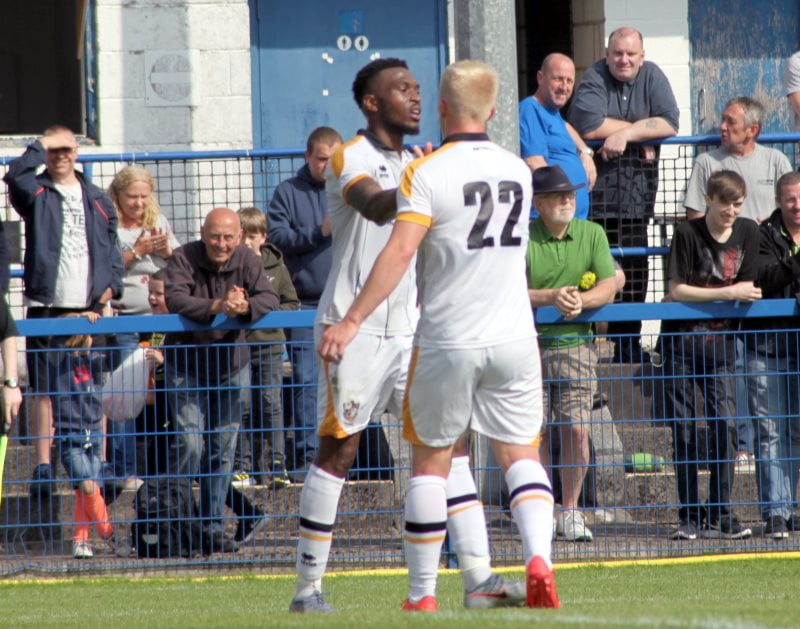 David Amoo celebrates a goal in a friendly game against Leek Town 2019