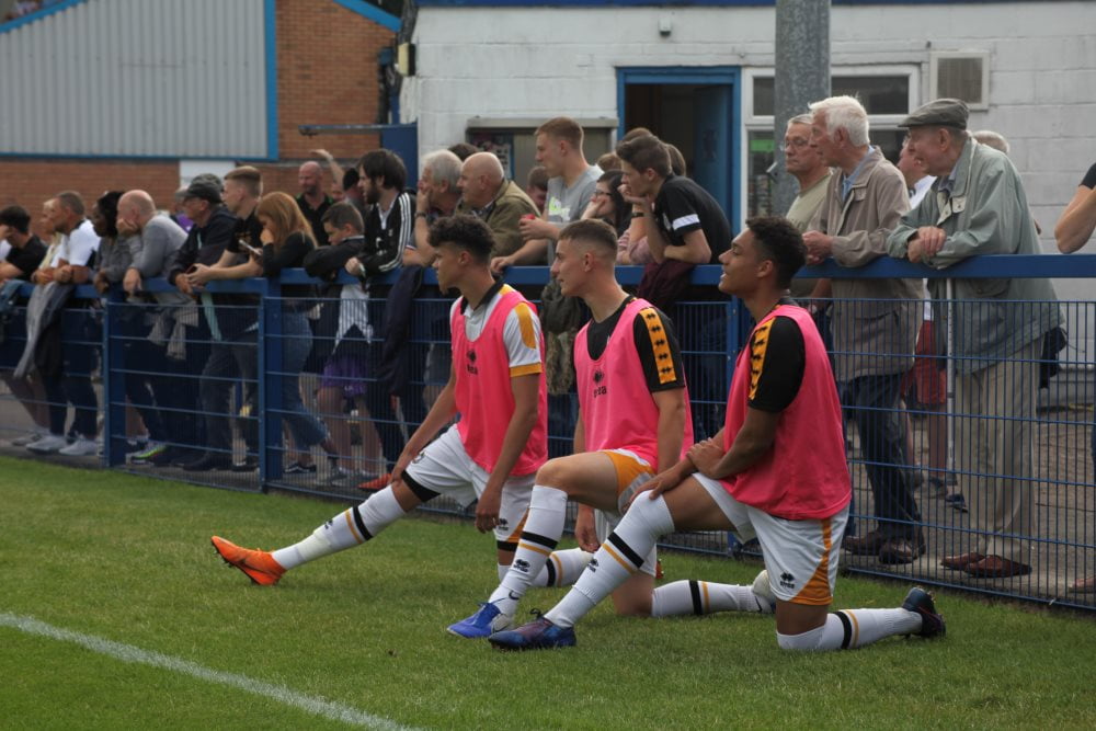Young subs Ryan Campbell-Gordon, Joe Berks and Lucas Green-Birch warm-up