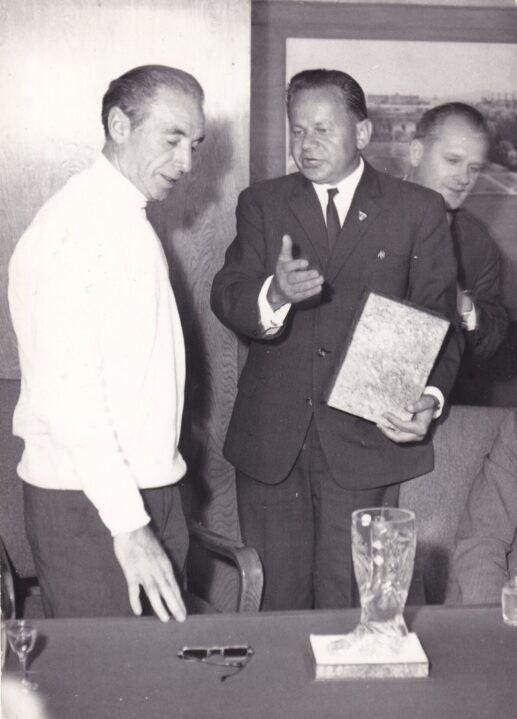 Sir Stanley Matthews receives a cut glass boot in the boardroom at Czechglass.