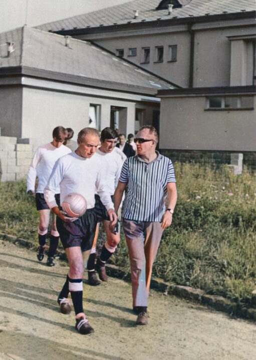 Sir Stanley Matthews (with John James and Mick Cullerton in the background) leads the team out for the game against Skuter - colourised version