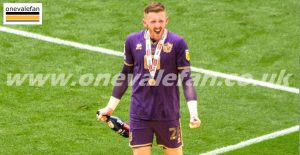 Goalkeeper Aidan Stone celebrates promotion at Wembley stadium