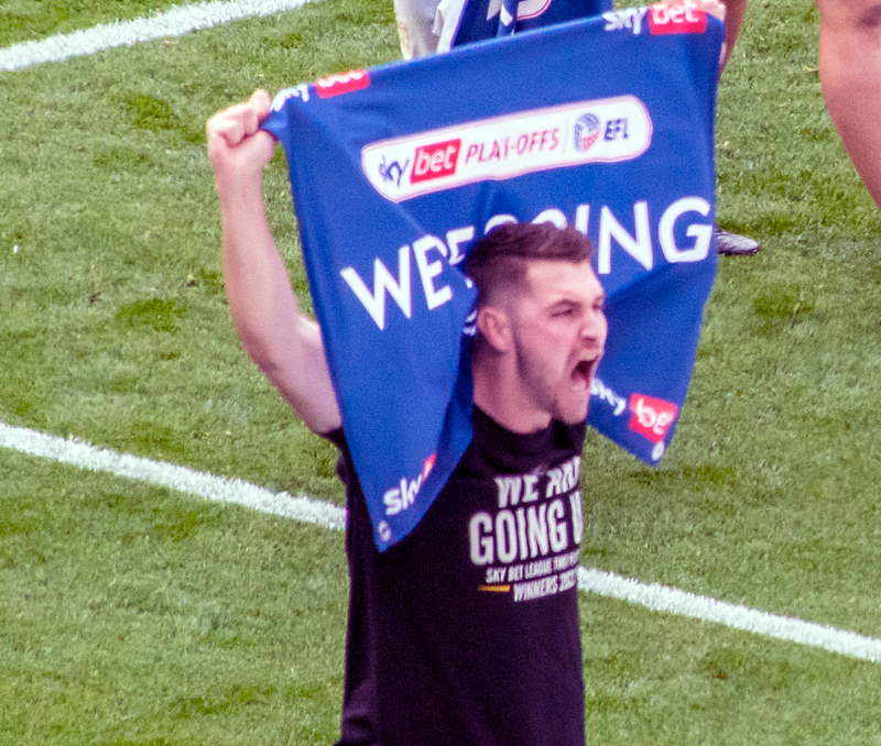 Port Vale midfielder Brad Walker celebrates promotion in 2022