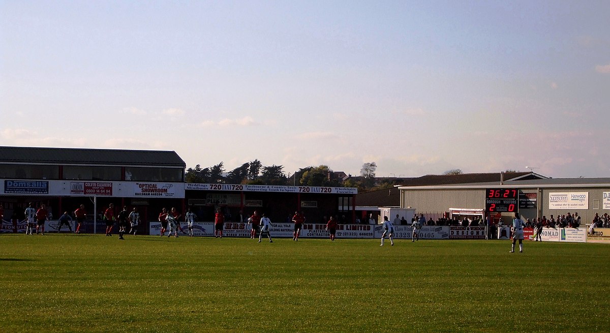 "File:Eastbourne Borough v Sutton United (8126238413).jpg" by grassrootsgroundswell is licensed under CC BY 2.0