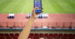 high-angle-hand-holding-smartphone Football Betting. Image - https://www.freepik.com/free-photo/high-angle-hand-holding-smartphone_32502937.htm#fromView=search&page=1&position=1&uuid=0e301e21-eb28-4efb-8020-51c5877d416c from freepik.com