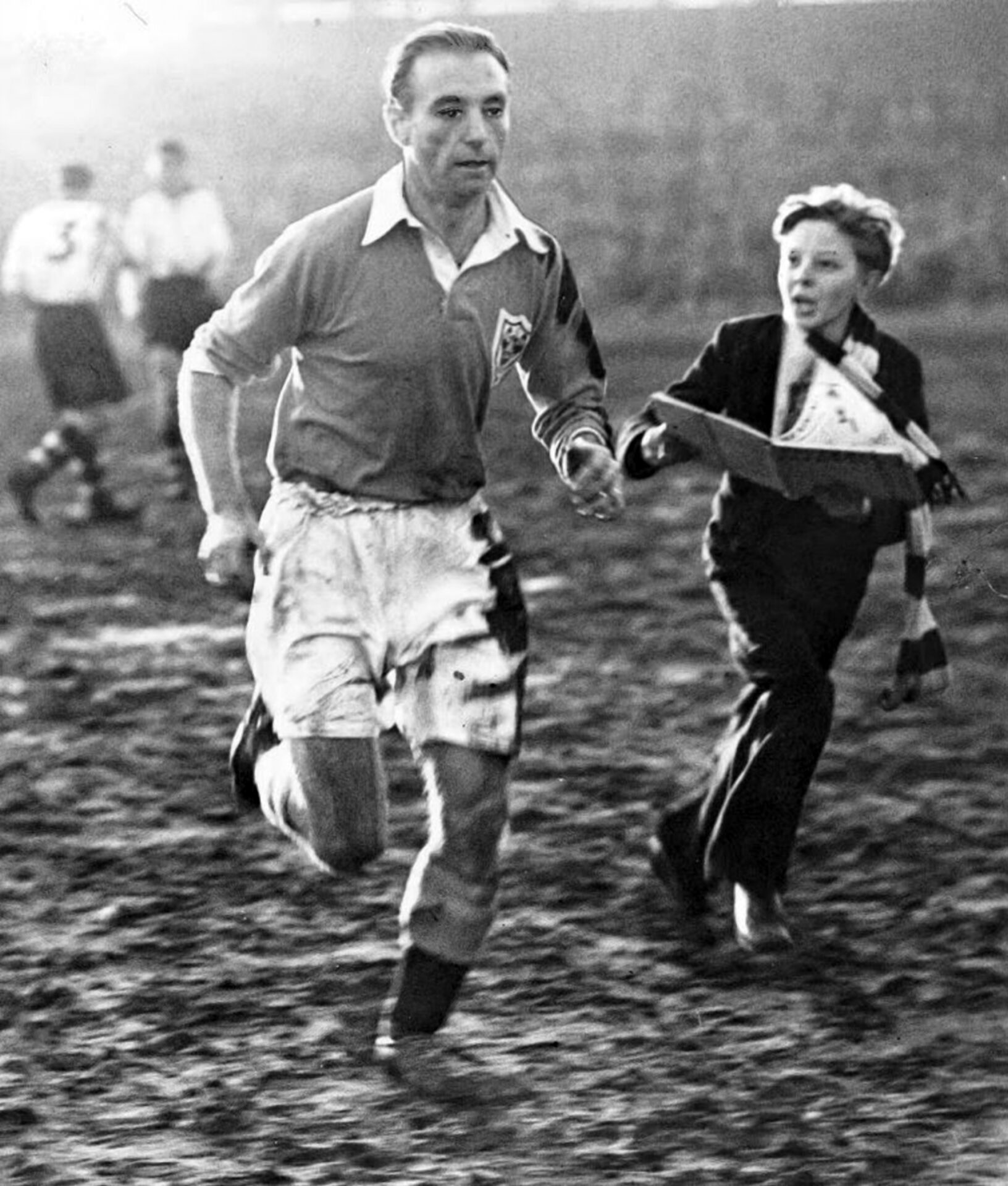 Team photos (L) Stanley Matthews runs off the pitch (R)
